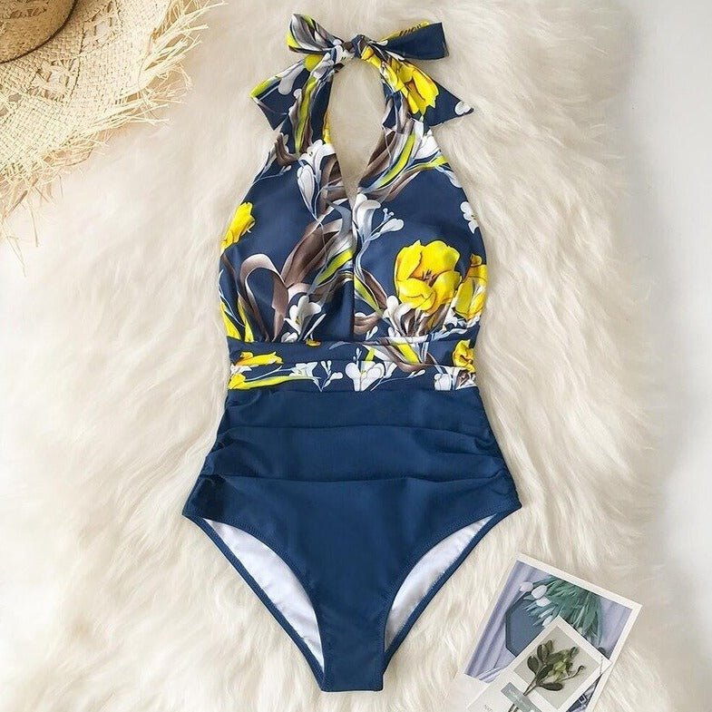 FLOWY - One-piece swimsuit with floral print